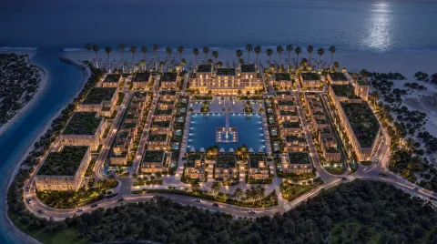 Aerial view of Mira Ocean Estates at night, between the Arabian Sea and the canal
