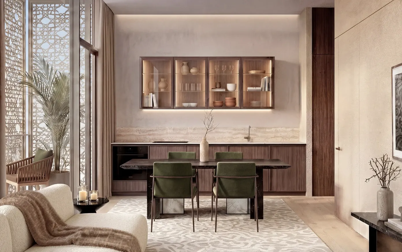 A furnished Mira Ocean Estates kitchen and dining area with green velvet chairs, backlit cabinetry and mashrabiya screens
