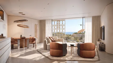 A furnished Mira Ocean Estates living and dining room with a sea view
