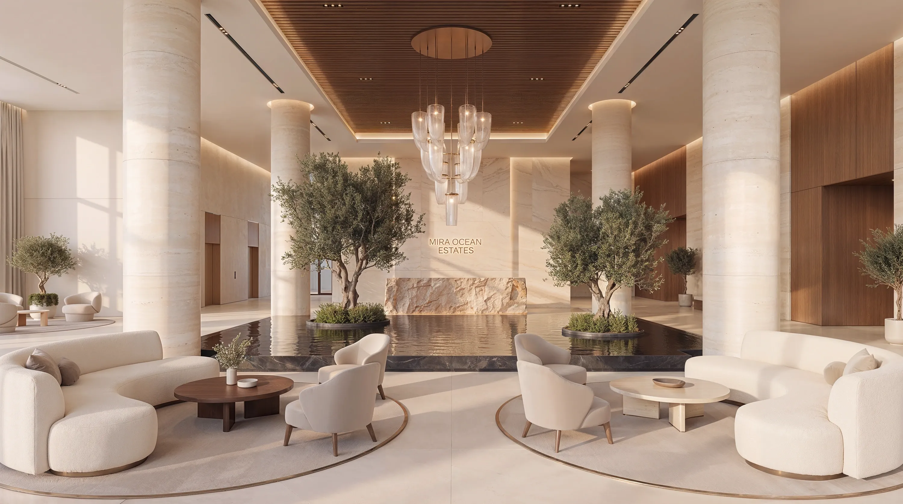 The Mira Ocean Estates lobby, with olive trees and a chandelier over a reflecting pool