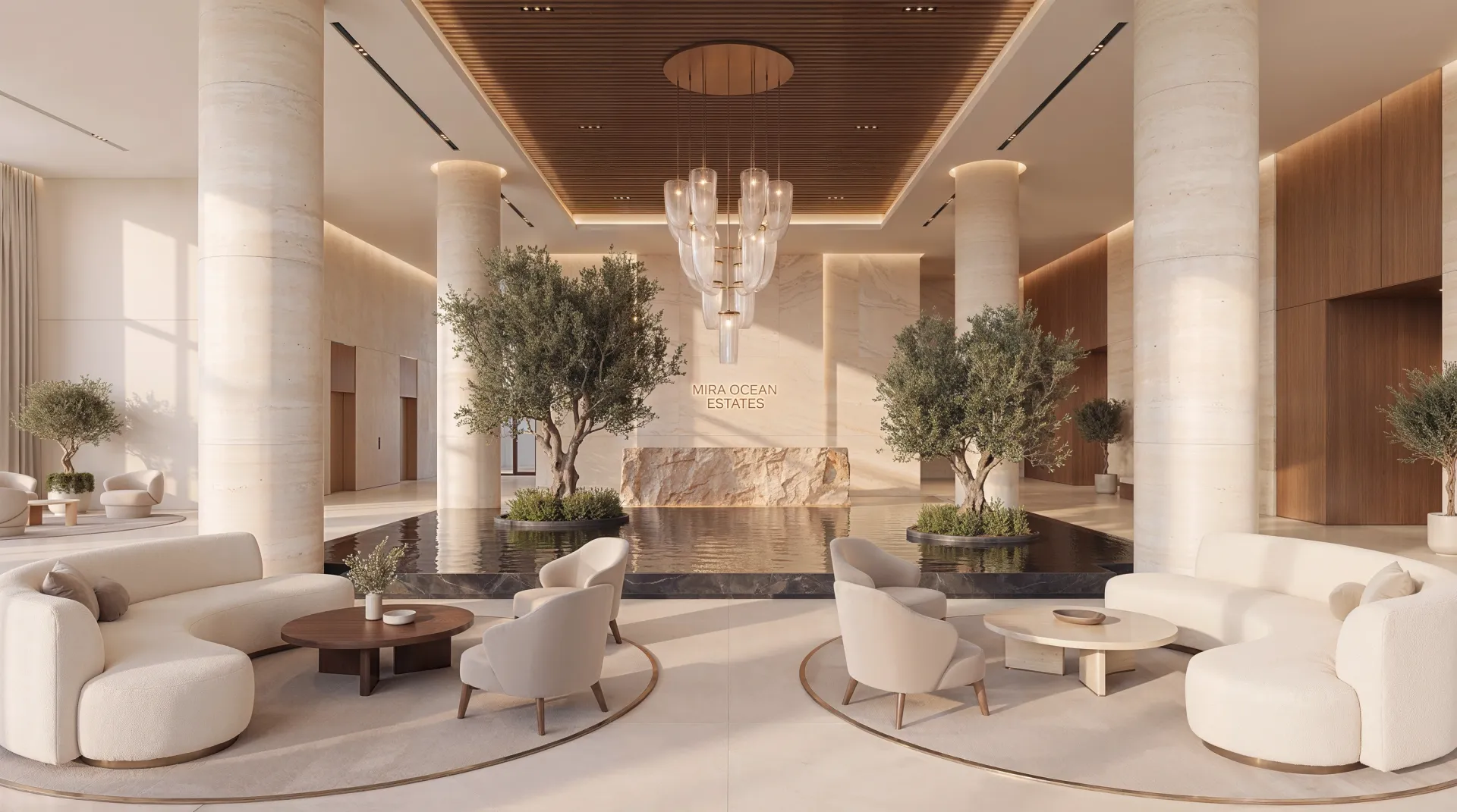 Die Lobby von Mira Ocean Estates mit Olivenbäumen und einem Leuchter über einem Wasserspiegel